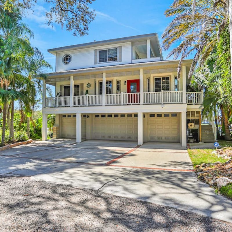 Luxurious waterfront home with pool game room dock