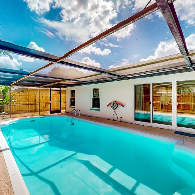 Coastal home with pool lanai patio and fireplace